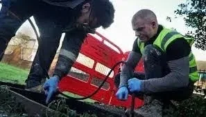 Professional conducting CCTV inspection of drainage pipes with advanced technology2